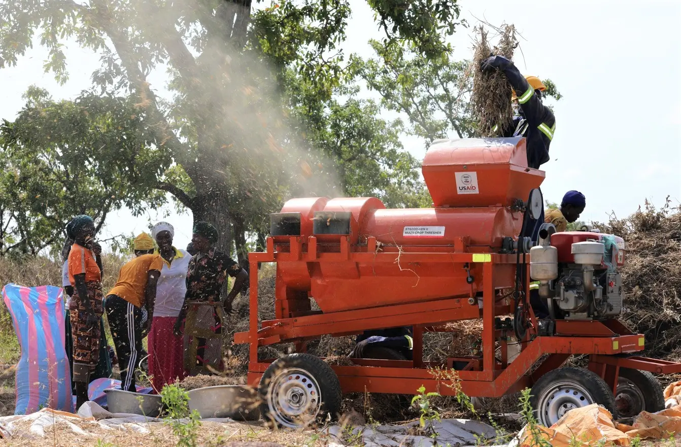 Soya farmers threshing their harvest with Sayetech's multi-crop thresher